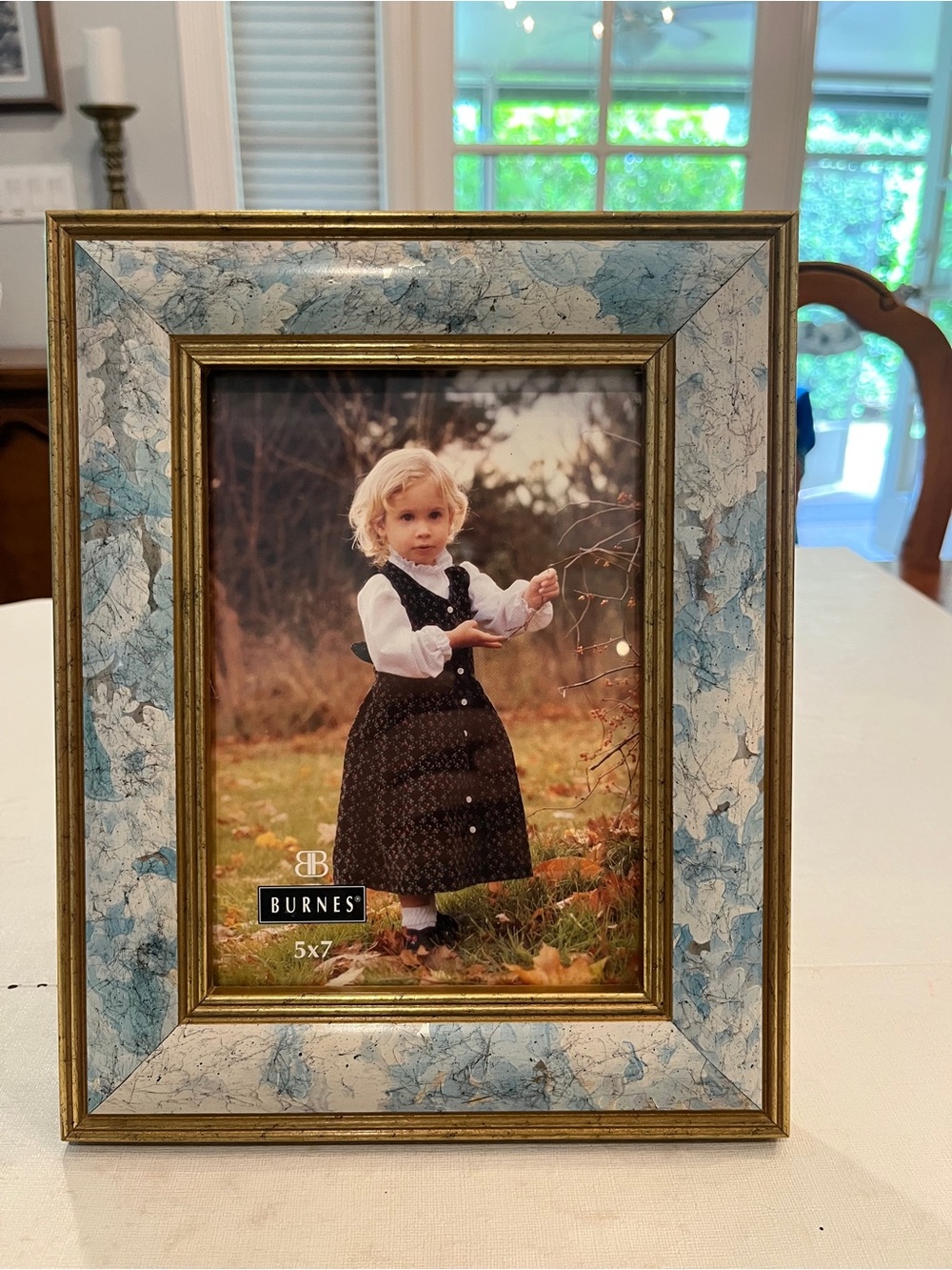 Vintage pastel blue floral and golden edged frame. Distressed